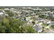 Neighborhood aerial showcasing mature trees, well-manicured lawns, and attractive houses at 1237 Windy Bay Shl, Tarpon Springs, FL 34689