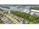 Aerial view featuring a waterfront community with serene views and mature trees at 1237 Windy Bay Shl, Tarpon Springs, FL 34689