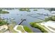 Aerial view showcasing the waterfront community's marina, boat slips, and waterway access at 1237 Windy Bay Shl, Tarpon Springs, FL 34689