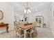 Cozy dining room with rustic dining table, stylish accents, and a tranquil ambiance for intimate meals at 1237 Windy Bay Shl, Tarpon Springs, FL 34689