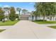 Charming single-Gathering home with a manicured lawn and a long driveway leading to the attached two-car garage at 1237 Windy Bay Shl, Tarpon Springs, FL 34689