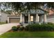 Charming single-Gathering home with a well-manicured lawn, a covered porch, and inviting curb appeal at 1237 Windy Bay Shl, Tarpon Springs, FL 34689