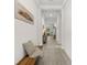 Inviting hallway featuring neutral walls, tile flooring, and stylish decor, creating a welcoming atmosphere at 1237 Windy Bay Shl, Tarpon Springs, FL 34689