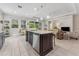 Open concept kitchen with a large island and stainless steel appliances at 1237 Windy Bay Shl, Tarpon Springs, FL 34689
