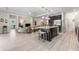 Spacious kitchen with island that leads to the living room at 1237 Windy Bay Shl, Tarpon Springs, FL 34689