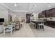 Open-concept living room seamlessly blends with the modern kitchen, creating a harmonious living space at 1237 Windy Bay Shl, Tarpon Springs, FL 34689