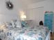 Bright bedroom with coordinated bedding and white furniture at 1250 S Pinellas Ave # 1013, Tarpon Springs, FL 34689