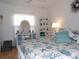 Bright bedroom with coordinated bedding and white furniture at 1250 S Pinellas Ave # 1013, Tarpon Springs, FL 34689