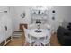 Bright dining room with white furnishings, stylish decor, and a cozy, inviting atmosphere at 1250 S Pinellas Ave # 1013, Tarpon Springs, FL 34689