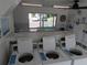 Bright laundry room equipped with multiple washers and dryers, plus a folding area near a window at 1250 S Pinellas Ave # 1013, Tarpon Springs, FL 34689