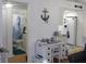 Coastal themed interior with desk, kitchen and bathroom in view at 1250 S Pinellas Ave # 1013, Tarpon Springs, FL 34689