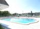 Community pool with well-maintained deck and lounge chairs, great for relaxation at 1250 S Pinellas Ave # 1013, Tarpon Springs, FL 34689