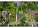 An aerial view showing the landscaped backyard with a screened pool and spacious surroundings at 126 Holly Tree Ln, Brandon, FL 33511