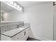 Modern bathroom features a white vanity with gray countertop and subway tile backsplash at 126 Holly Tree Ln, Brandon, FL 33511