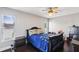 Bedroom with two windows and dark furniture, and blue colored comforter at 126 Holly Tree Ln, Brandon, FL 33511