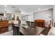 Dining area seamlessly connects to the kitchen and offers a serene view of the pool, creating an inviting atmosphere at 126 Holly Tree Ln, Brandon, FL 33511