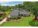 Beautiful single-story home boasts a lush lawn and manicured landscaping that accentuates its charming facade at 126 Holly Tree Ln, Brandon, FL 33511