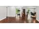 Large open living space with hardwood floors and plenty of natural light, adjacent to dining area at 126 Holly Tree Ln, Brandon, FL 33511