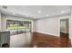 Spacious living room featuring hardwood floors, recessed lighting and a sliding glass door to the pool area at 126 Holly Tree Ln, Brandon, FL 33511