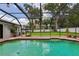 Screened-in pool area offering a private outdoor space for relaxation and entertainment at 126 Holly Tree Ln, Brandon, FL 33511