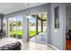View of the backyard and patio area through sliding glass doors in the living area at 12801 Stanwyck Cir, Tampa, FL 33626