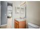 Bathroom featuring a traditional vanity with decorative mirror and modern fixtures at 12801 Stanwyck Cir, Tampa, FL 33626