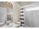 Neutral bathroom featuring tiled shower with window and a classic vanity with neutral countertop at 12801 Stanwyck Cir, Tampa, FL 33626