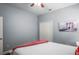 Bedroom featuring hardwood floors, and a painting of a bridge hanging above the bed at 12801 Stanwyck Cir, Tampa, FL 33626