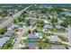 A higher aerial view showing single Gathering home with swimming pool in a busy suburb at 12879 112Th St, Largo, FL 33778