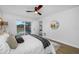 Bright bedroom with a sliding glass door to the pool and neutral decor at 12879 112Th St, Largo, FL 33778