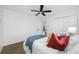 Cozy bedroom with a ceiling fan, closet, and neutral decor providing a relaxing atmosphere at 12879 112Th St, Largo, FL 33778