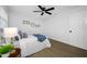 Bright bedroom includes a ceiling fan, coastal decor, and hardwood floors for a serene space at 12879 112Th St, Largo, FL 33778