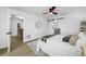 Comfortable bedroom with ensuite bathroom, a ceiling fan, and natural light at 12879 112Th St, Largo, FL 33778