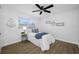 Comfortable bedroom features a ceiling fan, coastal decor, and window offering a cozy vibe at 12879 112Th St, Largo, FL 33778