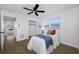 Relaxing bedroom with a ceiling fan, closet, and window creating a comfortable retreat at 12879 112Th St, Largo, FL 33778