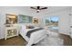 Cozy bedroom with a large window, access to pool, and neutral decor at 12879 112Th St, Largo, FL 33778
