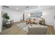 Spacious living room featuring wood flooring, neutral paint, and modern decor at 12879 112Th St, Largo, FL 33778