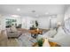 Inviting living room with neutral decor, wood flooring, and lots of natural light at 12879 112Th St, Largo, FL 33778