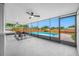 Screened patio with ceiling fans overlooking a pool and a fenced-in backyard at 12879 112Th St, Largo, FL 33778