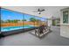 Screened patio with ceiling fans overlooking a pool and a fenced-in backyard at 12879 112Th St, Largo, FL 33778