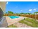 Backyard view featuring a large pool, screened-in patio, and fenced-in yard at 12879 112Th St, Largo, FL 33778