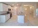 Well-lit kitchen with modern appliances, granite countertops, and white cabinetry at 13334 Ogden Glade Rd, Dade City, FL 33525