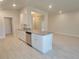 Well-lit kitchen with granite countertops, stainless steel appliances, and sleek cabinets at 13334 Ogden Glade Rd, Dade City, FL 33525