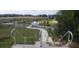Path alongside the pond and newly planted palm trees at 13334 Ogden Glade Rd, Dade City, FL 33525