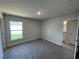Bedroom features neutral tones and access to an ensuite bathroom and walk-in closet at 13374 Ogden Glade Rd, Dade City, FL 33525