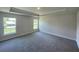 Spacious bedroom featuring neutral tones, ample natural light and a tray ceiling at 13374 Ogden Glade Rd, Dade City, FL 33525
