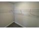A walk-in closet showing wire shelving and carpet at 13374 Ogden Glade Rd, Dade City, FL 33525