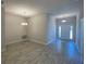 A dining area with a chandelier, neutral paint, and a view of the front entrance through glass paned doors at 13374 Ogden Glade Rd, Dade City, FL 33525