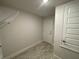 Hallway with a view of a closet with wire shelving at 13374 Ogden Glade Rd, Dade City, FL 33525