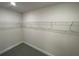 Walk-in closet with ample storage space and well-placed shelving at 13374 Ogden Glade Rd, Dade City, FL 33525